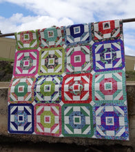 Churn it Round PDF Pattern.   Churn Dash Block variation. Uses Fat Quarters and a background fabric. Suitable for a confident Beginner quilter.